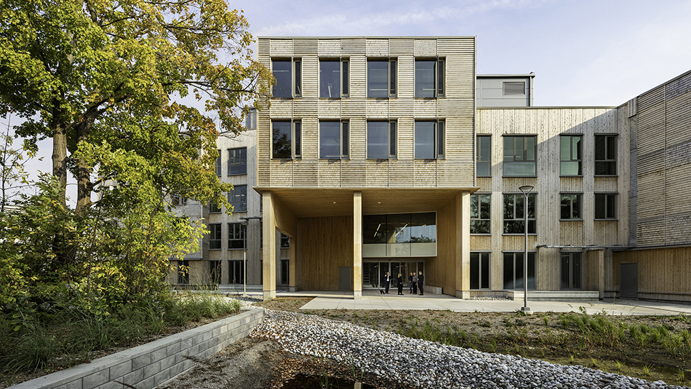 The exterior of a building with weathered grey wood siding