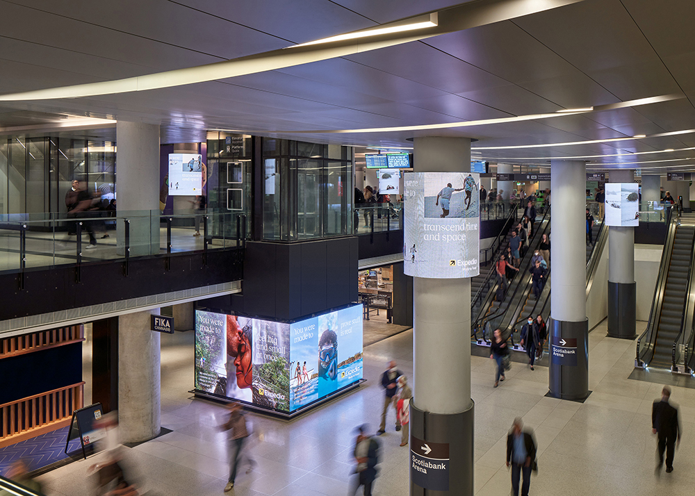 An two storey interior concourse, with people walking below