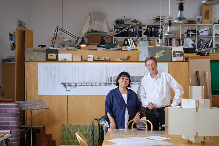 A portrait of Shim and Sutcliffe in their studio