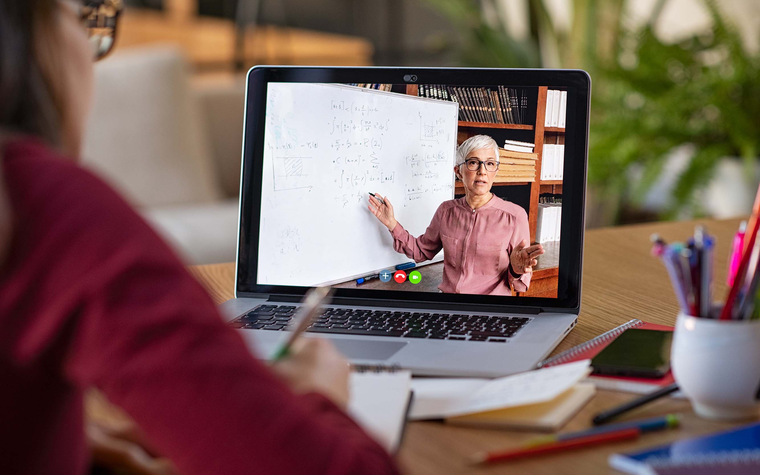 Image of an individual looking at information on a computer