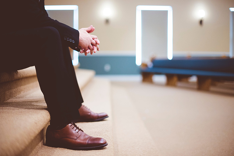 pic of man sitting on stairs