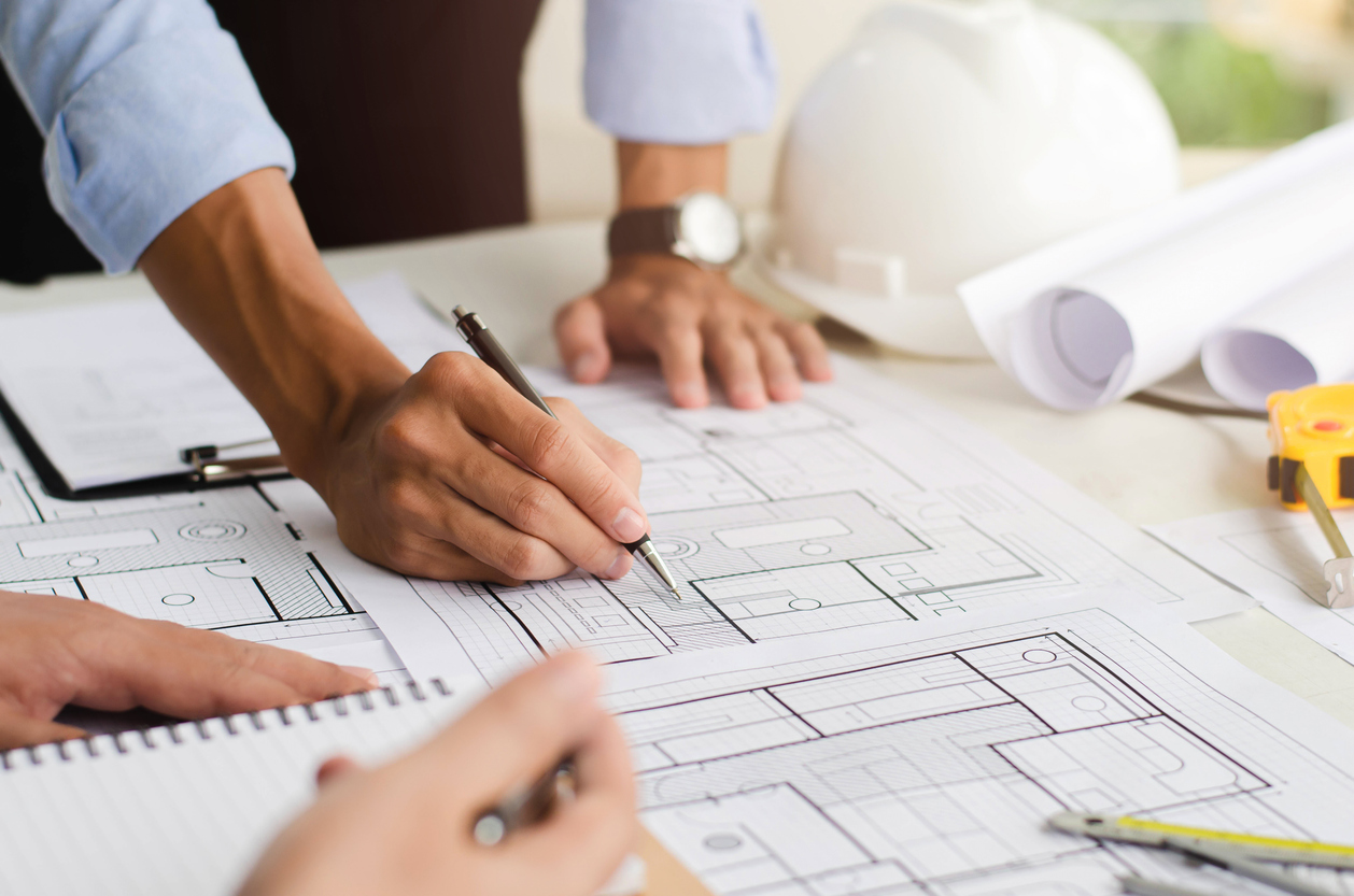 Pic of individual drawing/reviewing plans