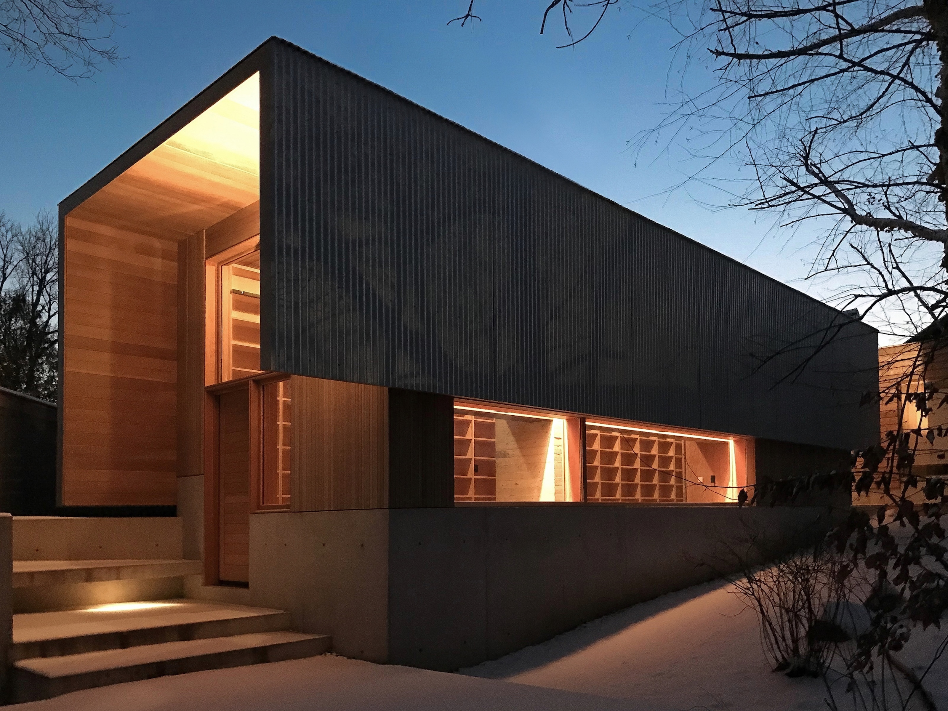 Exterior image with bookshelves visible through windows