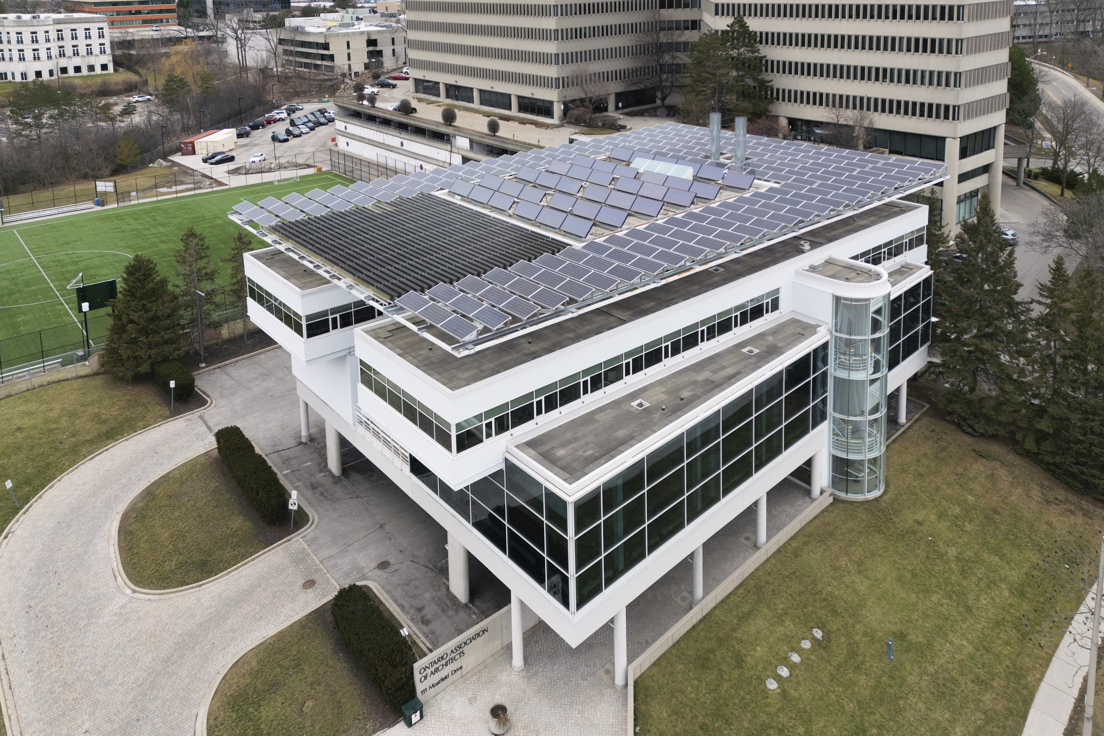 Exterior drone image of the roof of the OAA Headquarters featuring a close up view of the solar panels